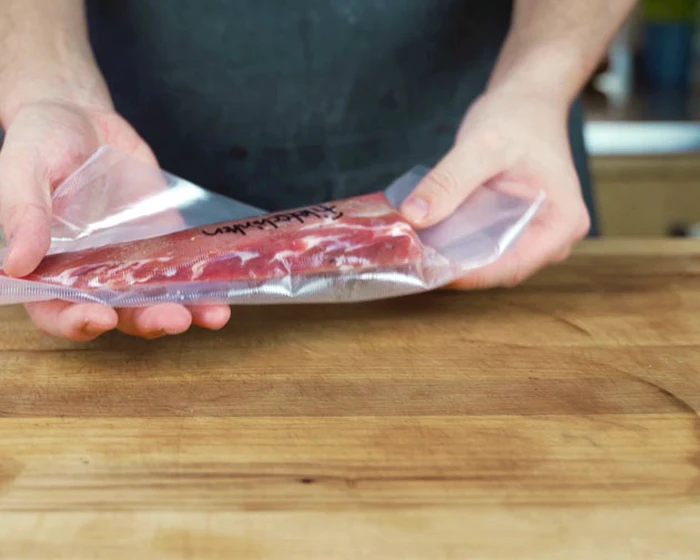 Tenderloin ham curing in a bag