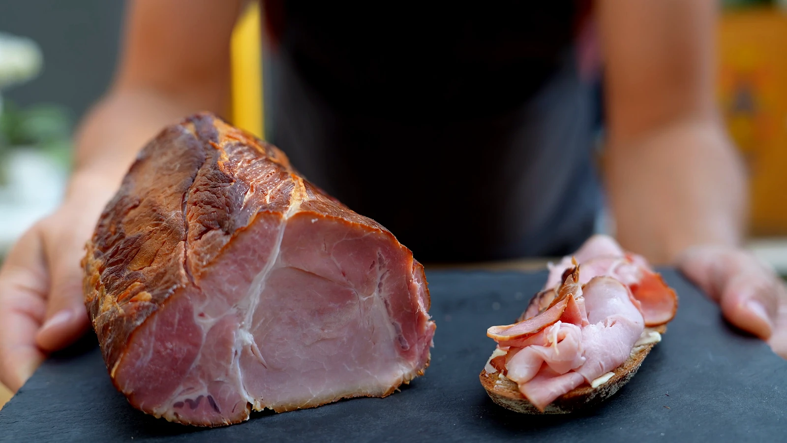 Hot-smoked cooked ham, cut and on bread