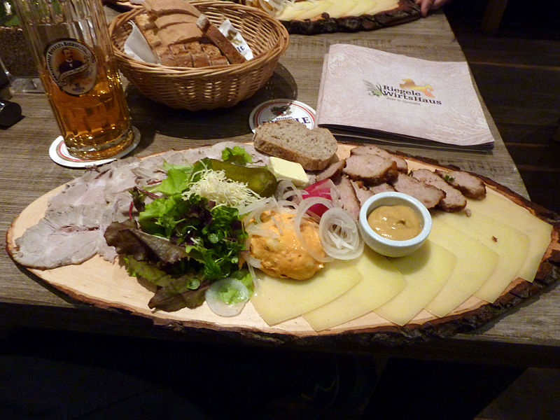 Bavarian Brotzeit platter with Speck, Obazda, white radish and crackling lard