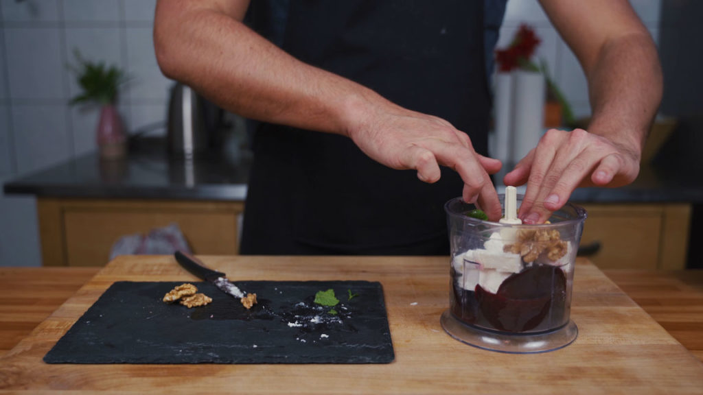 Adding walnuts to the blender