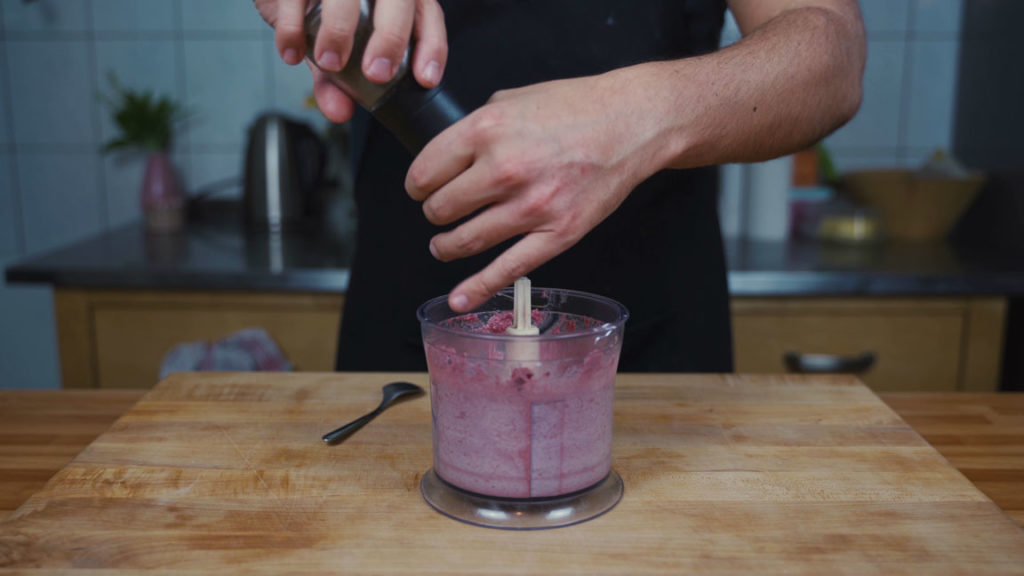 Seasoning beetroot spread with salt and pepper