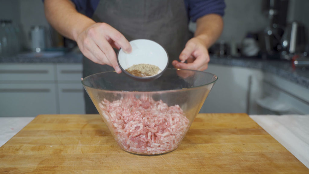 Adding seasonings to the ground meat