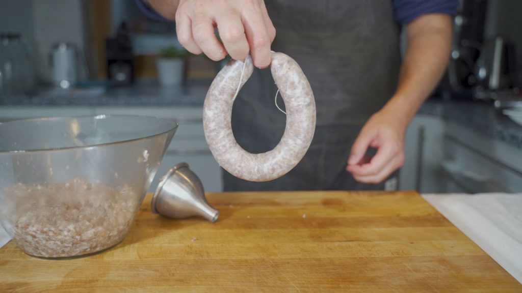 Tying Bregenwurst into rings
