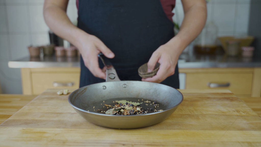 Toasting corned beef spices in a pan