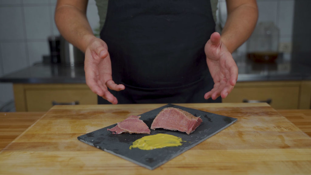 Finished corned beef sliced thinly against the grain