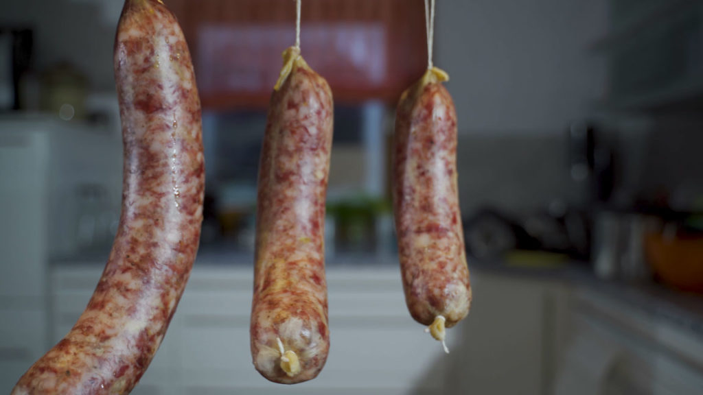 Cotechino hanging to ferment at room temperature