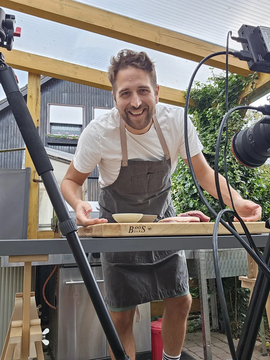 Daniel Wulf filming a recipe in the greenhouse