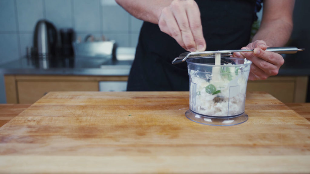 Grating garlic for feta spread