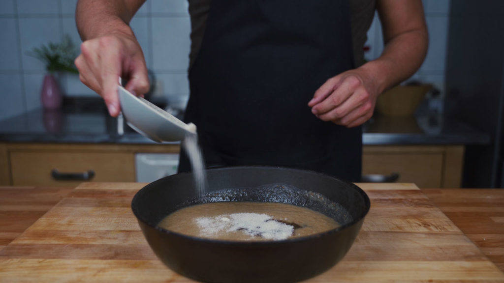 Adding vinegar and sugar to fig mustard