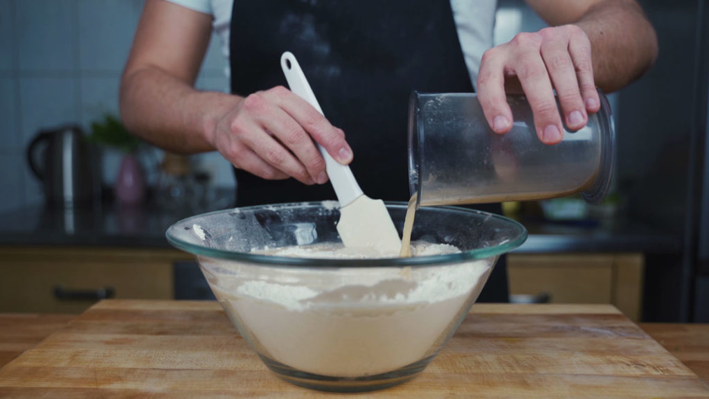 Add the yeast mixture to the flour