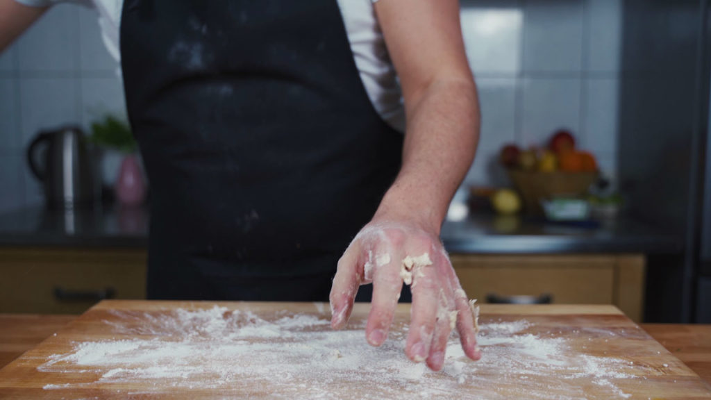 Dusting the work surface with flour