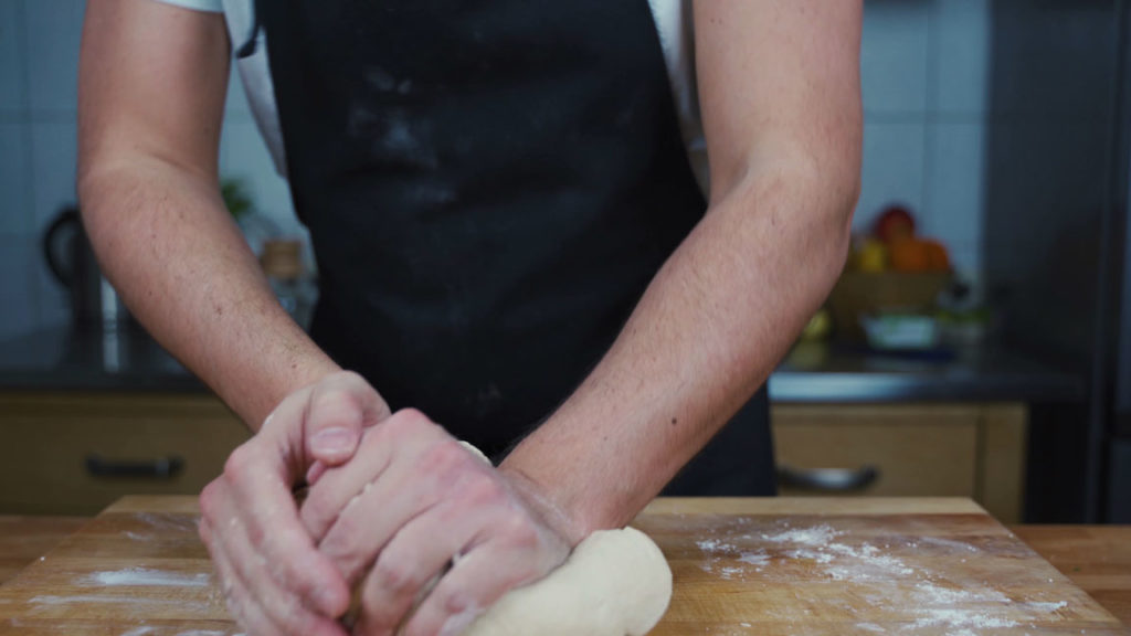 Kneading pretzel dough until smooth