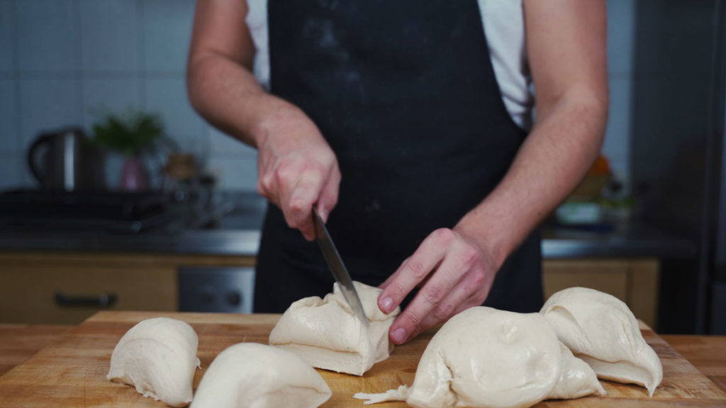 Dividing pretzel dough into 16 equal pieces