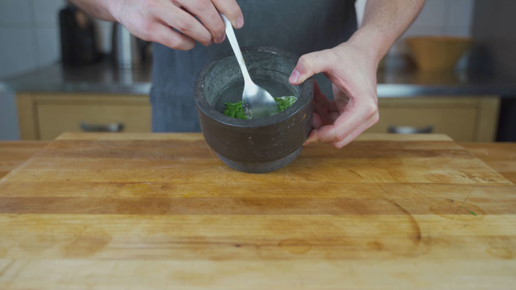 Mixing dill into the gravlax cure