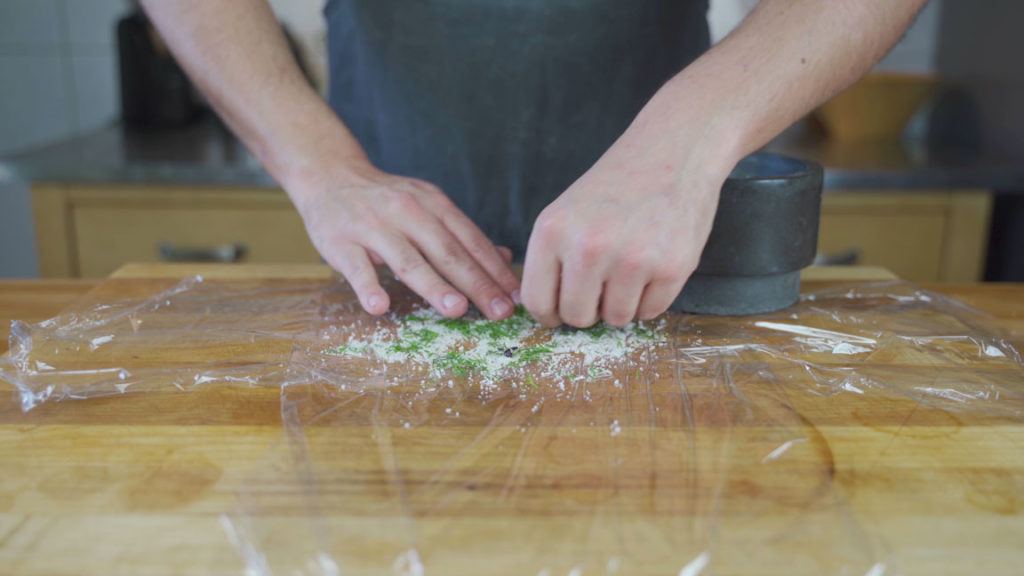 Spreading the gravlax cure on plastic wrap