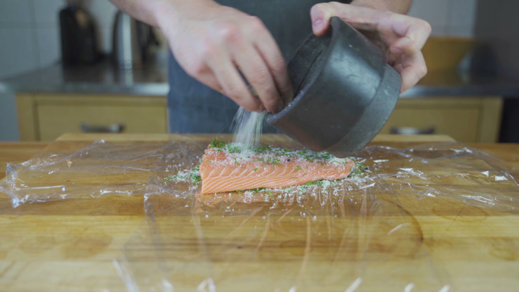 Salmon fillet completely covered with cure