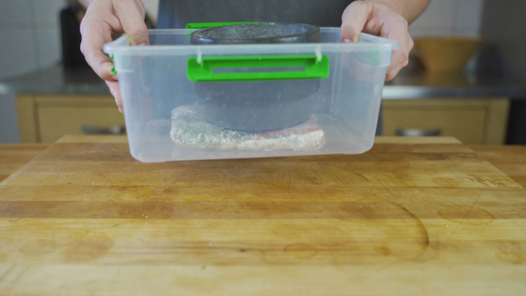 Gravlax curing in the refrigerator for 48 hours