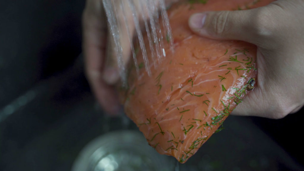 Rinsing the cured salmon