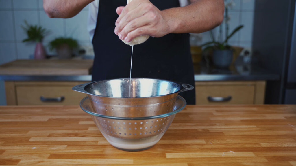 Wringing butter in a linen cloth