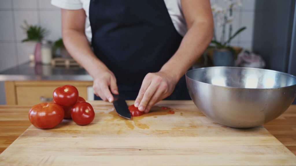 Slicing the tomatoes for ketchup