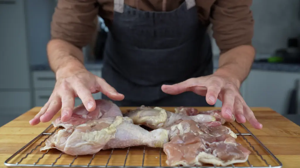 Cured chicken legs on the grill rack