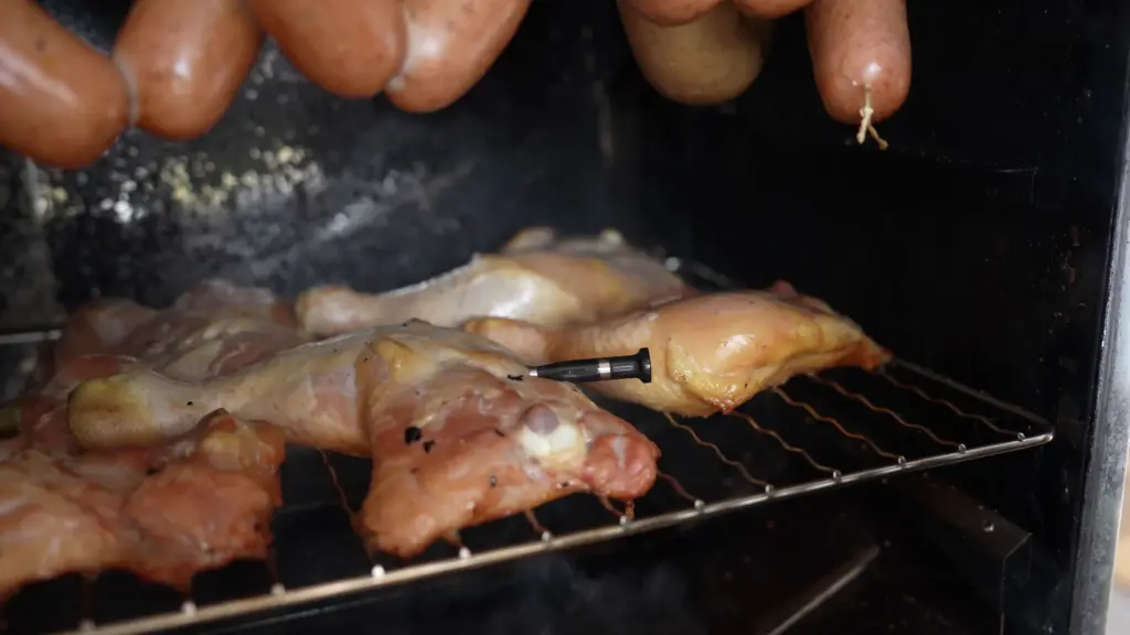 Chicken legs being smoked in the smoker