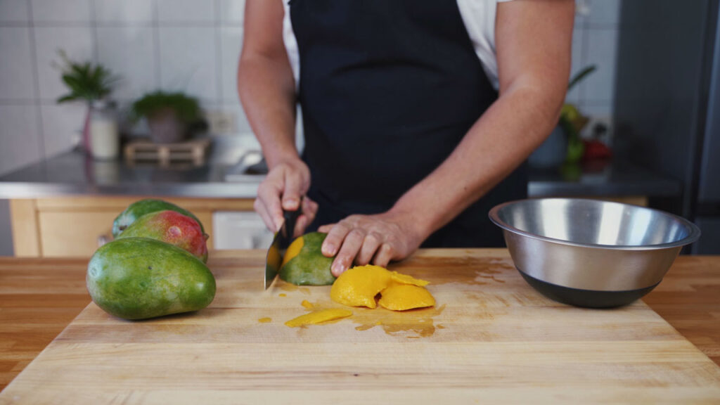 Peeling the mangoes