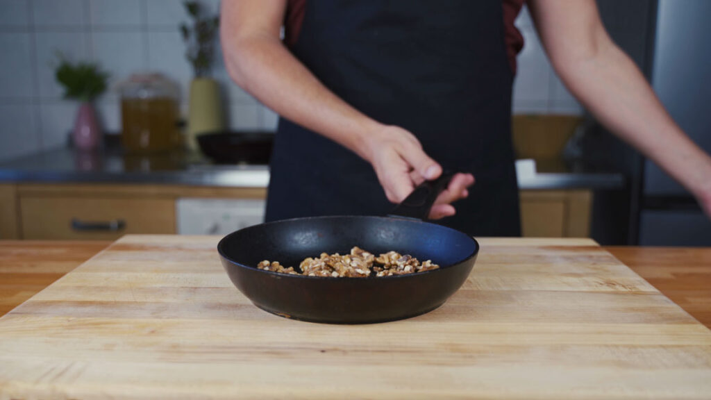 Toasting walnuts in a dry pan