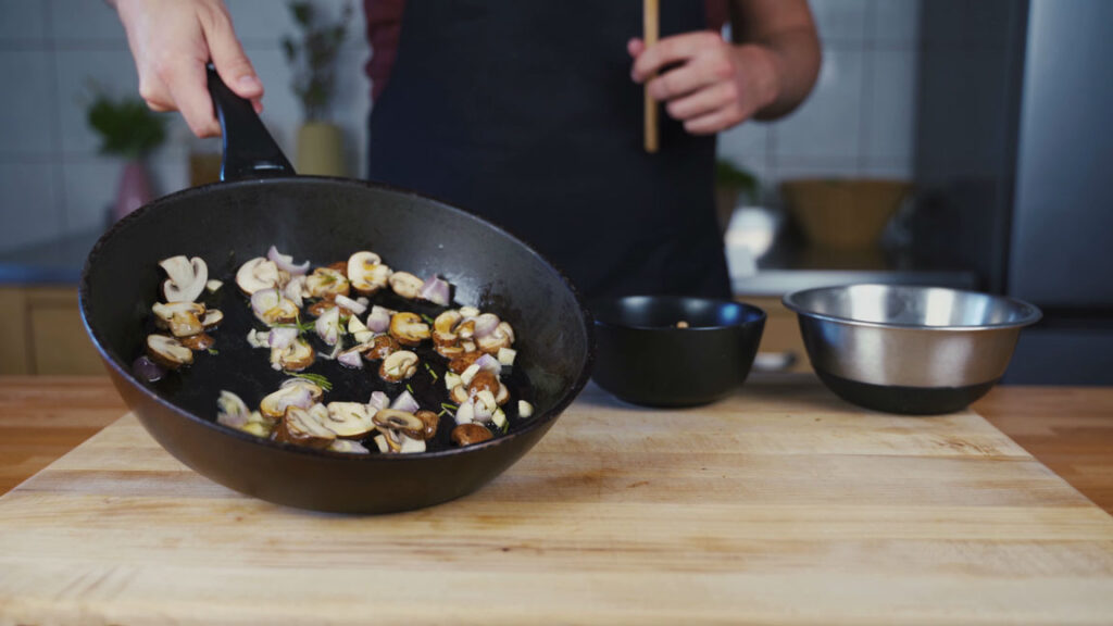 Mushrooms with shallots and rosemary in the pan
