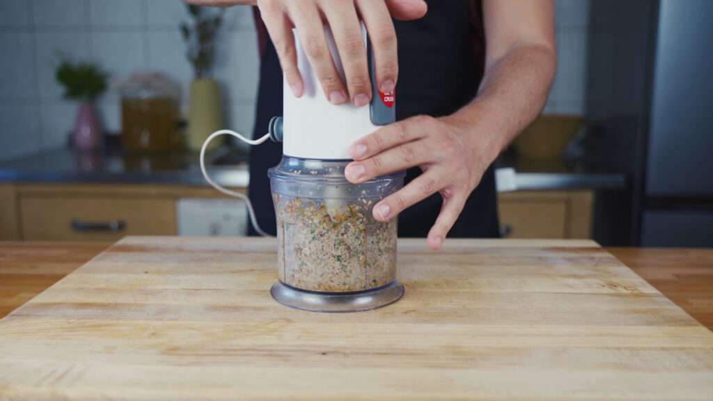 Puréeing the mushroom spread ingredients in a blender