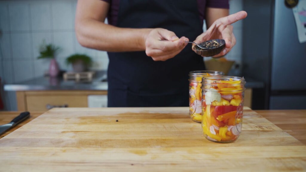 Peppers and spices in a jar