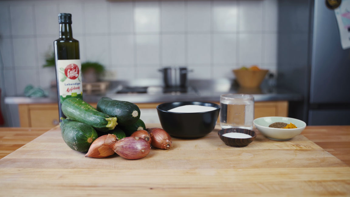 All the pickled zucchini ingredients on a table