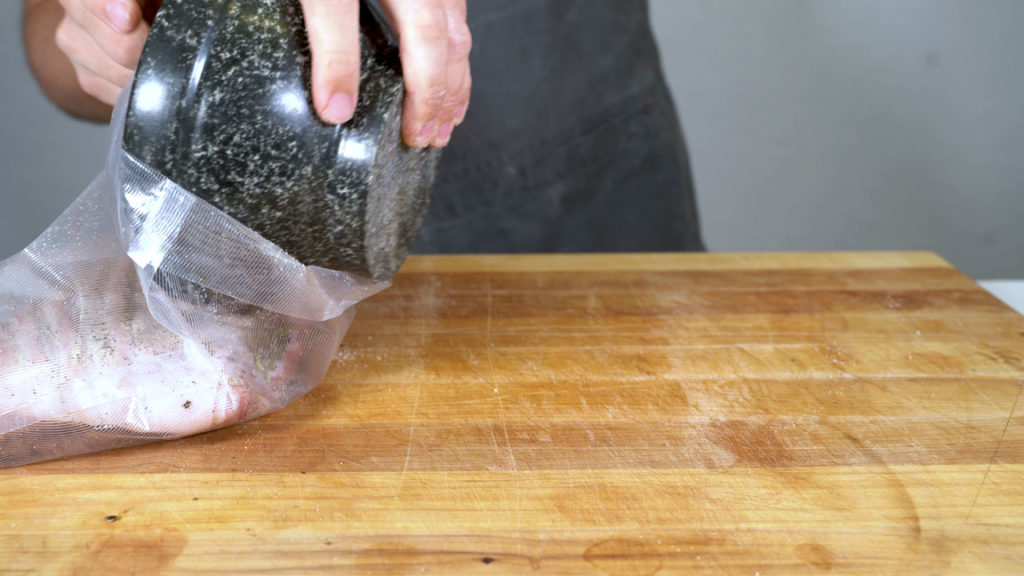 Pork belly and seasonings in a vacuum bag