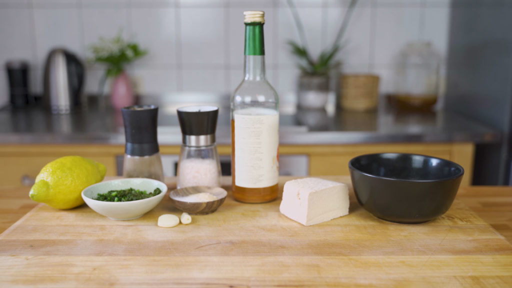 All the ingredients for tofu and herb spread on a table