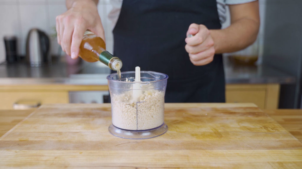 Adding cashews and liquids to the tofu