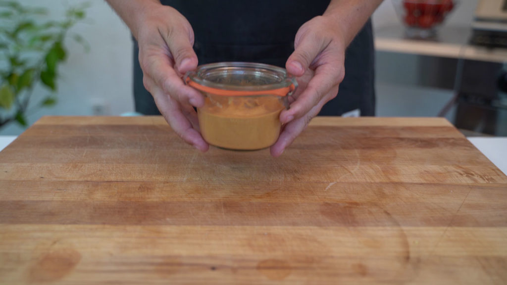 Filling jars with vegan Teewurst