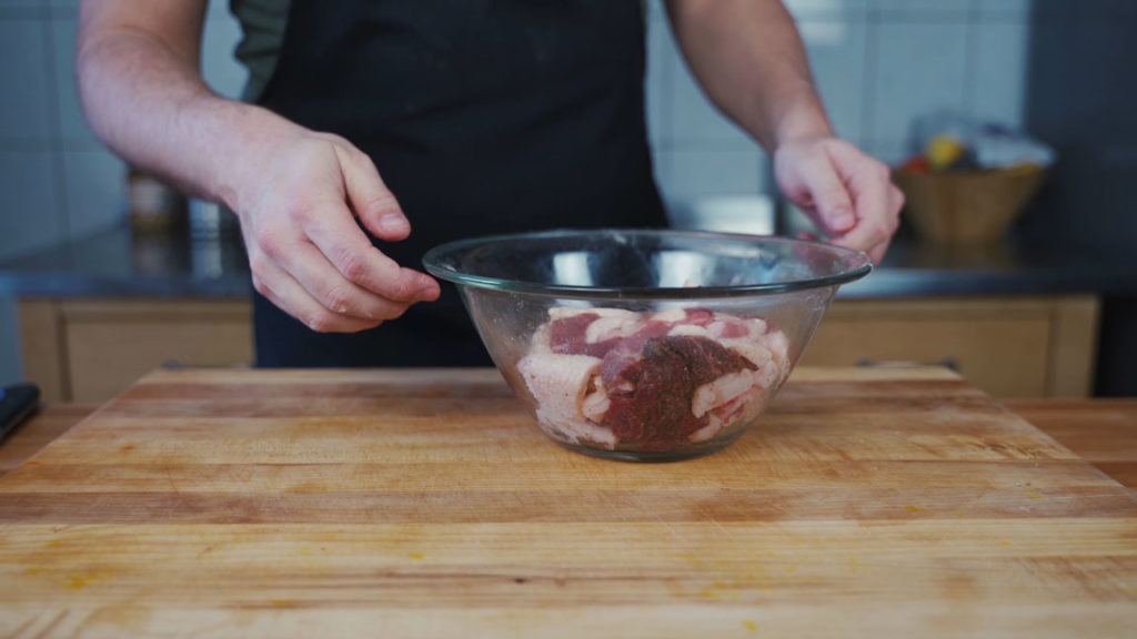 Partially freezing the seasoned meat